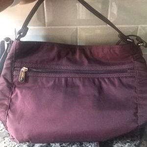 Egg Plant color Everything  Cross Body Bag/Purse, never used